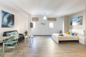 A bed or beds in a room at Loft Santa Lucia Centro