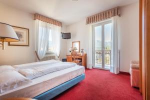 Voodi või voodid majutusasutuse Hotel Lucia toas