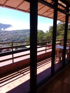 a view from a balcony of a building with a view at ASHBURN'S TRANSIENT BAGUIO- Dorm rooms 6th floor in Baguio