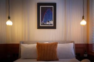 a living room with a couch and two lights at Capri Stays - Apartment Two - Two Bed Apartment in Blackpool