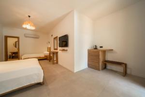 Postel nebo postele na pokoji v ubytování Zümrüt Çıralı Boutique Hotel