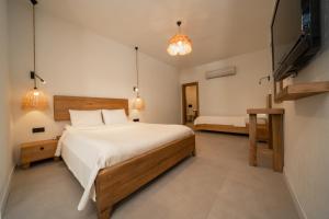 Postel nebo postele na pokoji v ubytování Zümrüt Çıralı Boutique Hotel