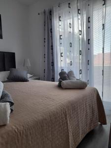 Posteľ alebo postele v izbe v ubytovaní Apartman Lucy