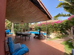 Κήπος έξω από το Villa met privé zwembad in Résidence Safari Village