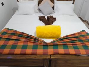 Giường trong phòng chung tại Dedunu Guest