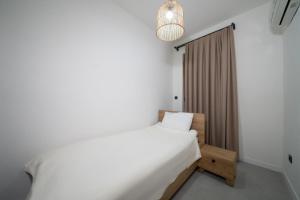 Postel nebo postele na pokoji v ubytování Zümrüt Çıralı Boutique Hotel