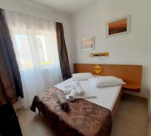 Ένα ή περισσότερα κρεβάτια σε δωμάτιο στο Vila karla