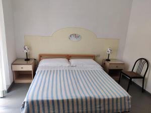 Postel nebo postele na pokoji v ubytování Hotel Villa Cecilia