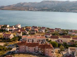 an aerial view of a town next to the water at Aurora in Pag