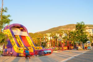 a playground with a slide in a park at DANTE APARTAMENT in Vlorë