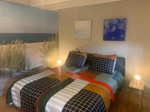 Postel nebo postele na pokoji v ubytování B&B De Vlasboerderij