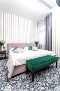 Llit o llits en una habitació de Hotel Park Kajetany