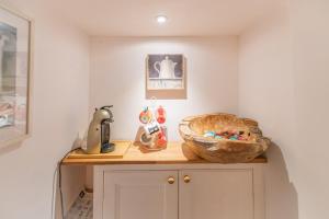 a kitchen with a counter with a bread bowl on it at The Flat at number 11 in Newton Abbot