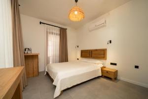 Postel nebo postele na pokoji v ubytování Zümrüt Çıralı Boutique Hotel