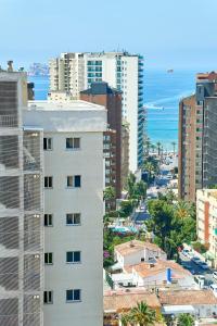 an aerial view of a city with buildings and the ocean at Don Gregorio-Fincas Benidorm in Benidorm