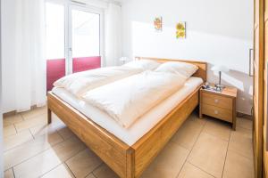 Ein Bett oder Betten in einem Zimmer der Unterkunft Schippershuus 08
