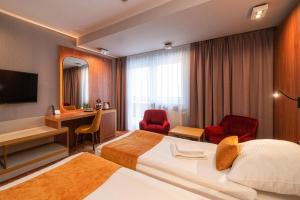 Televizors / izklaižu centrs naktsmītnē Hotel Stok