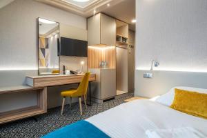 Gulta vai gultas numurā naktsmītnē Hotel Stok