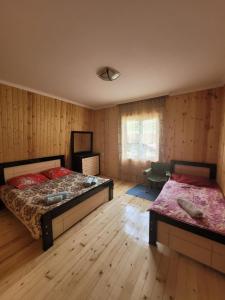 Postel nebo postele na pokoji v ubytování Guesthouse Miranda
