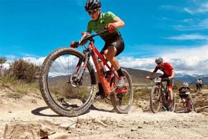 two people riding bikes on a dirt road at Apartamentos IRENE en el Pirineo Aragonés in Sabiñánigo +16 photos