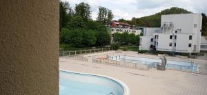 a view of a swimming pool from a building at Apartma Rogaska riviera in Rogaška Slatina