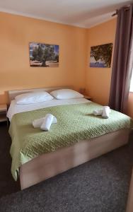 Posteľ alebo postele v izbe v ubytovaní Apartman Norma free parking