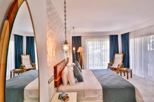 Postel nebo postele na pokoji v ubytování Arnna Hotel