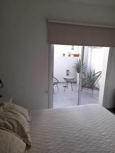 Postel nebo postele na pokoji v ubytování Departamento moderno y luminoso, en planta baja, con patio y excelente ubicación