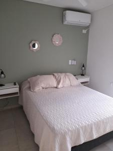 Postel nebo postele na pokoji v ubytování Departamento moderno y luminoso, en planta baja, con patio y excelente ubicación