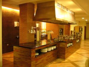 a large kitchen with a counter with apertureperture at AGH Canet in Canet de Berenguer