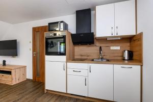 Kuchyňa alebo kuchynka v ubytovaní Apartmány Závětří