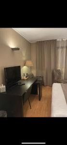 TV a/nebo společenská místnost v ubytování Park Hotel Airport