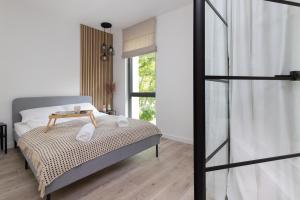 Posteľ alebo postele v izbe v ubytovaní Awanport Estate Gdynia by Noclegi Renters
