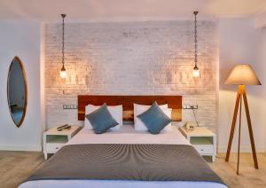 Postel nebo postele na pokoji v ubytování Arnna Hotel
