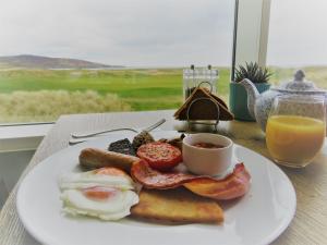 a plate of food on a table at Machrie Hotel & Golf Links in Port Ellen