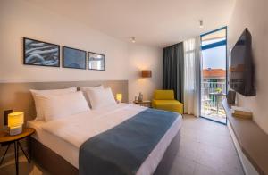 Postel nebo postele na pokoji v ubytování Maistra Select Funtana All Inclusive Resort