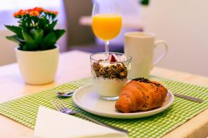 
a plate of food on a table with a cup of coffee at Anabelle Bed and Breakfast in Budapest
