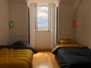 Posteľ alebo postele v izbe v ubytovaní La Hune Vauban - Appartement avec vue mer & port