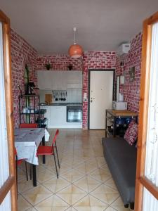 a living room with a brick wall at Appartamento Via Pitagora in Scalea