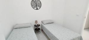 Postel nebo postele na pokoji v ubytování L'isola di Fimi