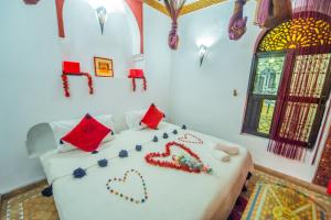 Postel nebo postele na pokoji v ubytování Riad Khabia & Spa