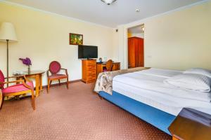 TV a/nebo společenská místnost v ubytování Hotel Pan Tadeusz