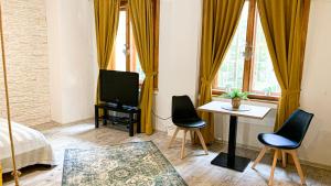 A seating area at Beautiful Place in Slovakia Bratislava Old Town Center with AC