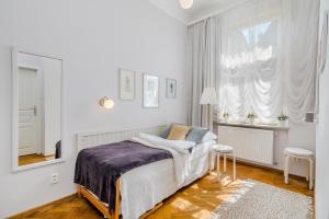 Ένα ή περισσότερα κρεβάτια σε δωμάτιο στο APT near OLD TOWN Prague by Michal&Friends