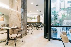 A restaurant or other place to eat at Athinais Hotel