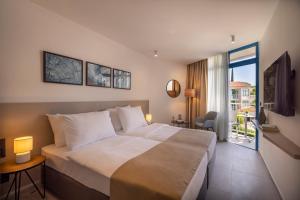 Postel nebo postele na pokoji v ubytování Maistra Select Funtana All Inclusive Resort