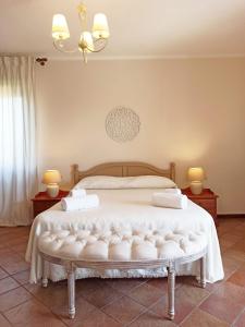 Ένα ή περισσότερα κρεβάτια σε δωμάτιο στο Casa Azzurra