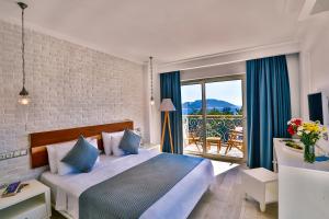 Postel nebo postele na pokoji v ubytování Arnna Hotel