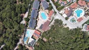 an overhead view of a building with a pool at Telmessos Neva Hotel - Halal-Non Alcoholic All Inclusive-Muhafazakar Hotel in Oludeniz