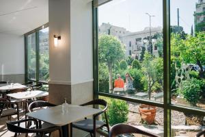 A restaurant or other place to eat at Athinais Hotel
